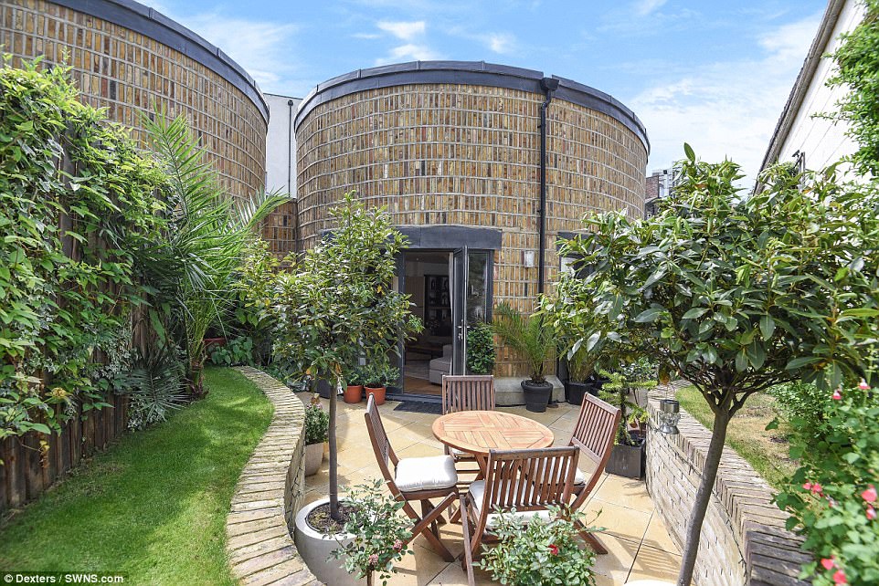 The eye-catching Round House in Battersea, has two bedrooms and two bathrooms, an attractive reception room and manicured gardens