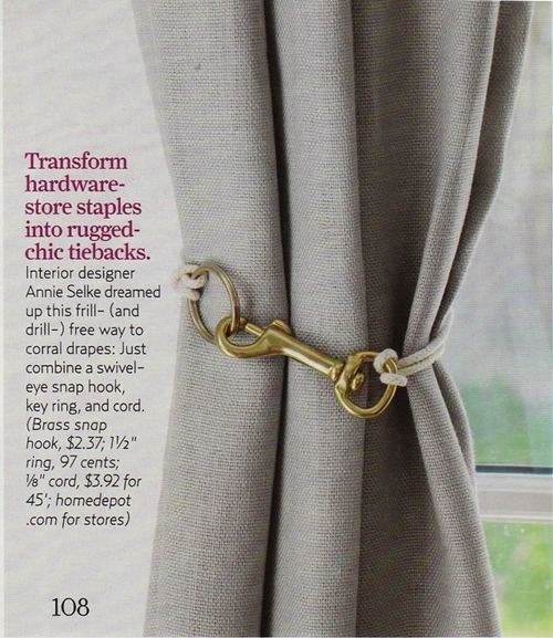 Use simple brass hardware as curtain tie-backs.