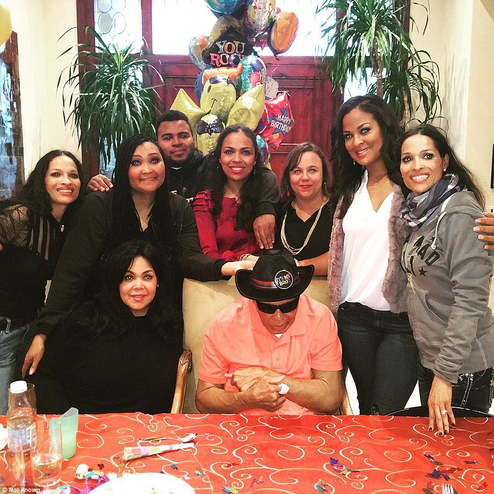United front: Ali, center, with some of his children – (from left) Jamillah, Maryum (standing), Khaliah (sitting), adopted son Asaad, Hana, Miya, Laila and Rasheda