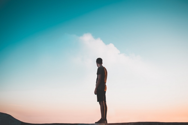 man standing on flat surface during daytime