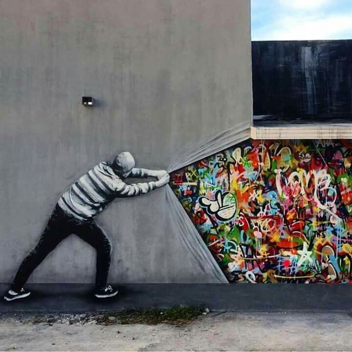 1 - Awesome street art of someone pulling back the concrete to reveal a colorful world underneath.