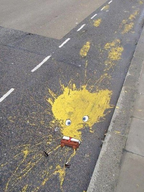 14 - Yellow splatt of paint made to look like a run-over version of Sponge Bob Squarepants.