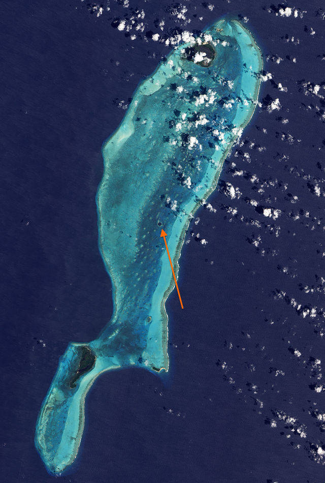 The Great Blue Hole from satellite. It's found in the Lighthouse Reef, an atoll off the coast of Belize, and part of the Belize Barrier Reef System.