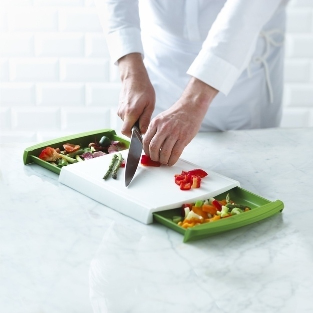 A cutting board that allows you to dispose of the unwanted pieces right away.