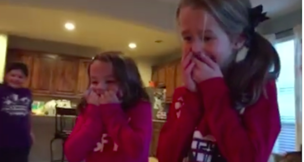 A mom and dad surprised their three daughters with the news that they had adopted a baby boy by hiding him under the Christmas tree — and the girls' reaction was completely adorable.