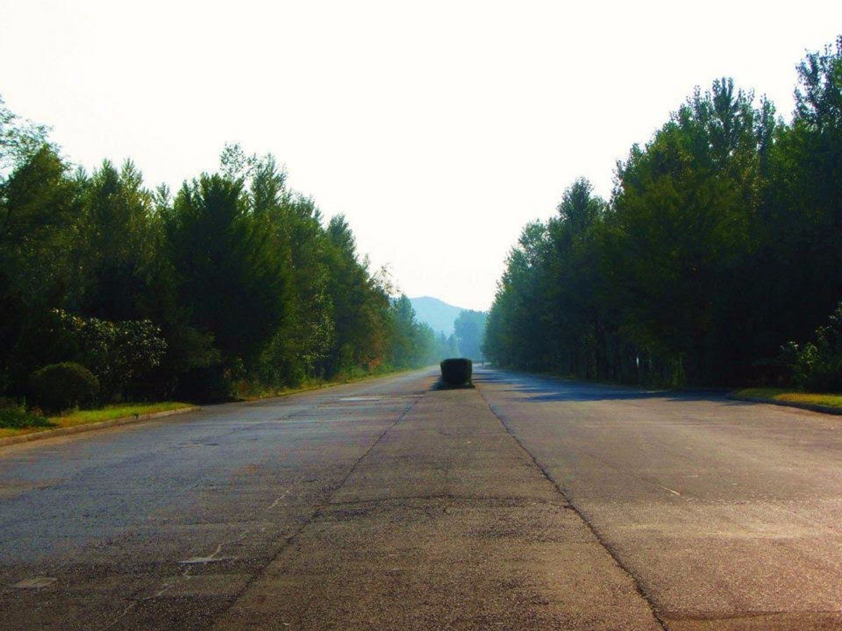 They drove 4 hours south to the Demilitarized Zone along the South Korea border. The creepy highway was filled with only tanks and troop convoys, no civilian vehicles.