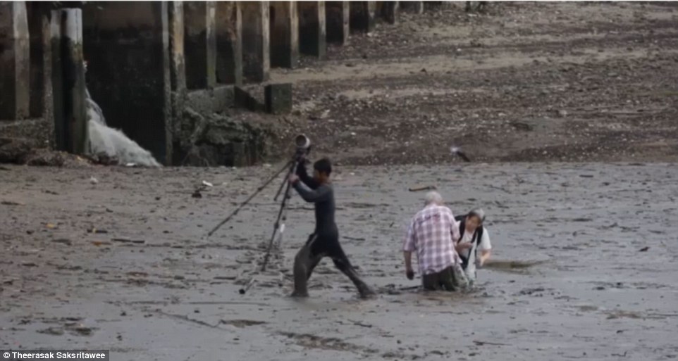 The quick-thinking fisherman first lifted the couples photography gear and rucksacks to higher ground