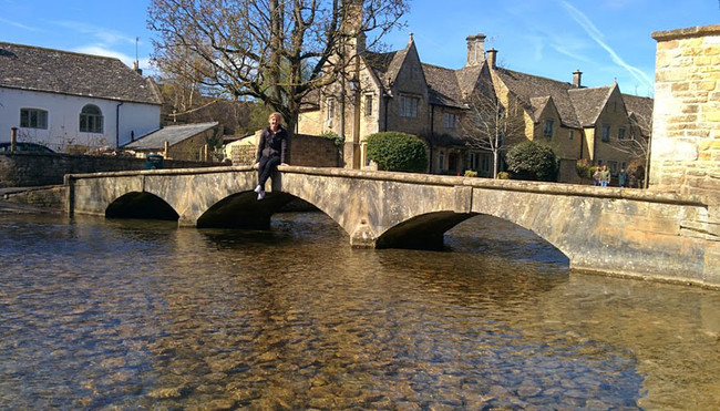 This picturesque village is often called the "Venice of the Cotswolds," as the River Windrush flows right through its center.