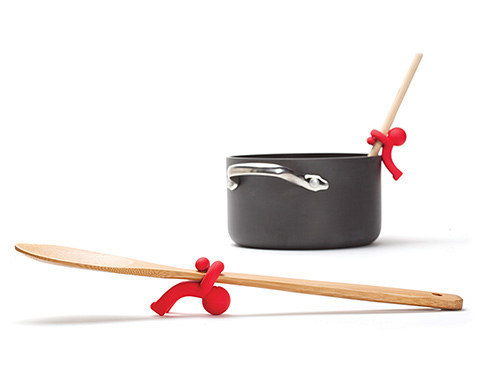 A little plastic guy who will keep your spoon from making a mess, even if you have to drop it for a second to deal with something else.
