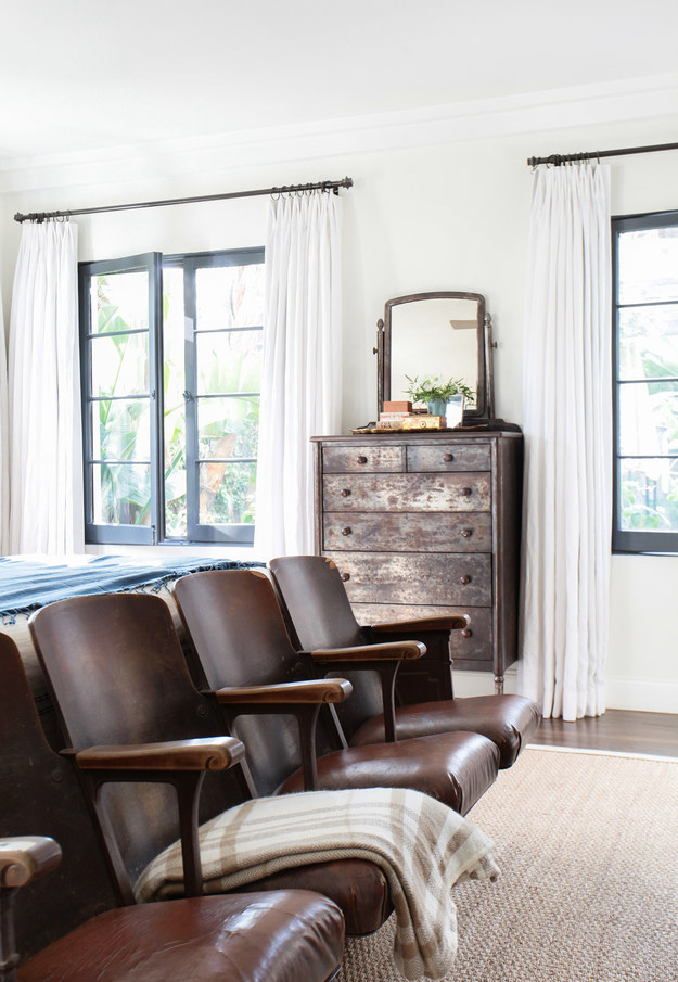 To make your windows (and room) look bigger, hang curtains in between the ceiling and the top of the window, with a rod that extends 6-10" on either side.
