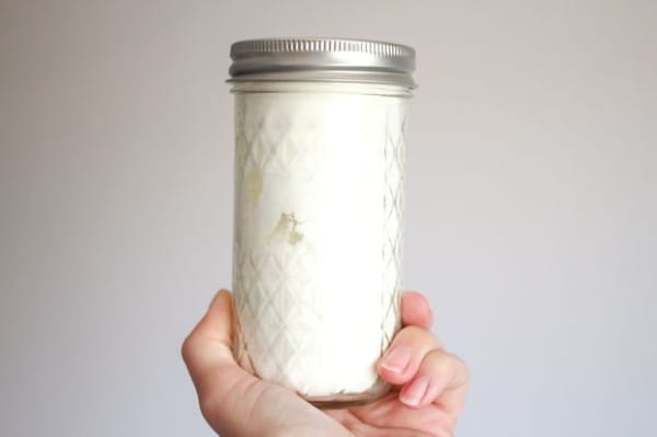Once she'd added the essential oils, she closed the jar and shook everything together. (If you can't smell the essential oils, add more!)